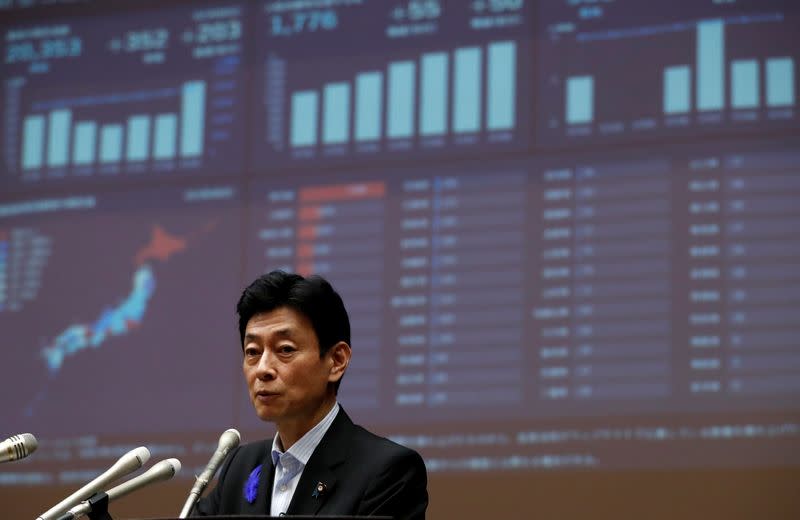 Japan's Economy Minister Yasutoshi Nishimura attends a joint news conference with Tokyo Governor Yuriko Koike in Tokyo