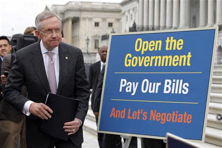 U.S. Senate Majority Leader Harry Reid (D-NV) arrives on the steps of the U.S. Capitol in Washington, October 9, 2013. REUTERS/Jason Reed