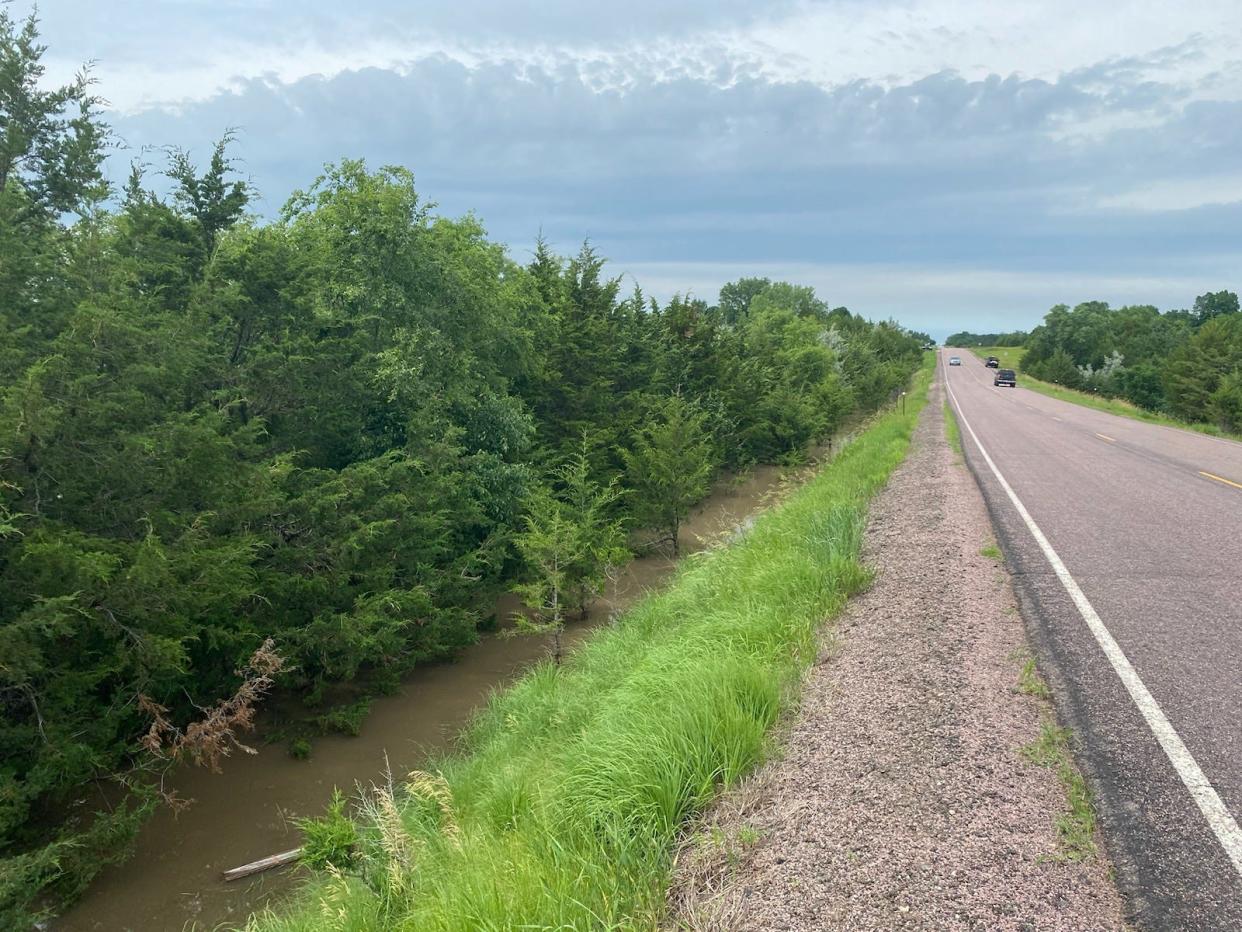 An image shows a flooded ditch along 480th Avenue on Saturday afternoon, June 22, 2024, near Lake Alvin.