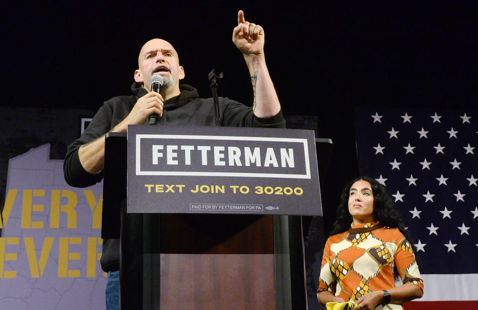 Pennsylvania Lt. Gov. and Democratic Senate nominee John Fetterman, with wife Gisele Fetterman nearby, speaks inside the Bayfront Convention Center in Erie on Aug. 12, 2022. It was Fetterman's first campaign event since suffering a stroke on May 13.