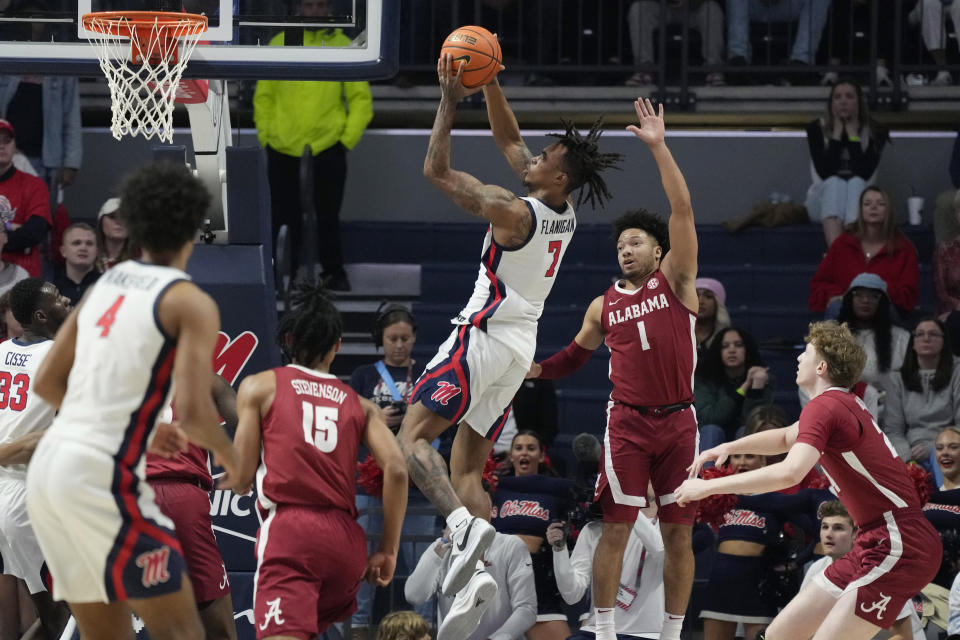 Mississippi guard Allen Flanigan (7) shoots over a group of Alabama players during the first half of an NCAA college basketball game, Wednesday, Feb. 28, 2024, in Oxford, Miss. (AP Photo/Rogelio V. Solis)