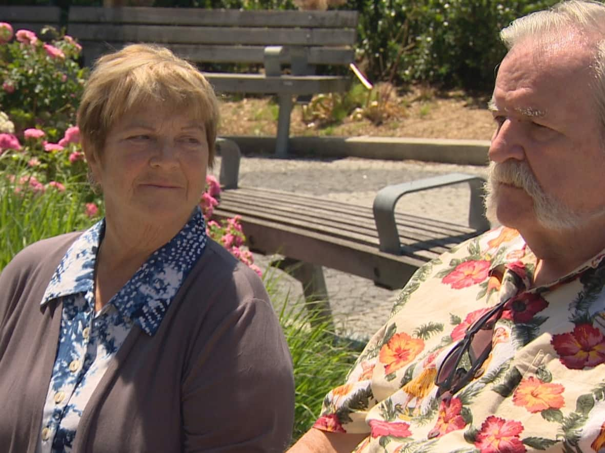 Wendy Stanyon, left, looks at her brother, David Stanyon, right. Wendy, from Vancouver, flew into Toronto to take David to a Blue Jays game. Despite months of planning, the pair missed the game because wheelchair-accessible taxis failed to show up. (CBC - image credit)