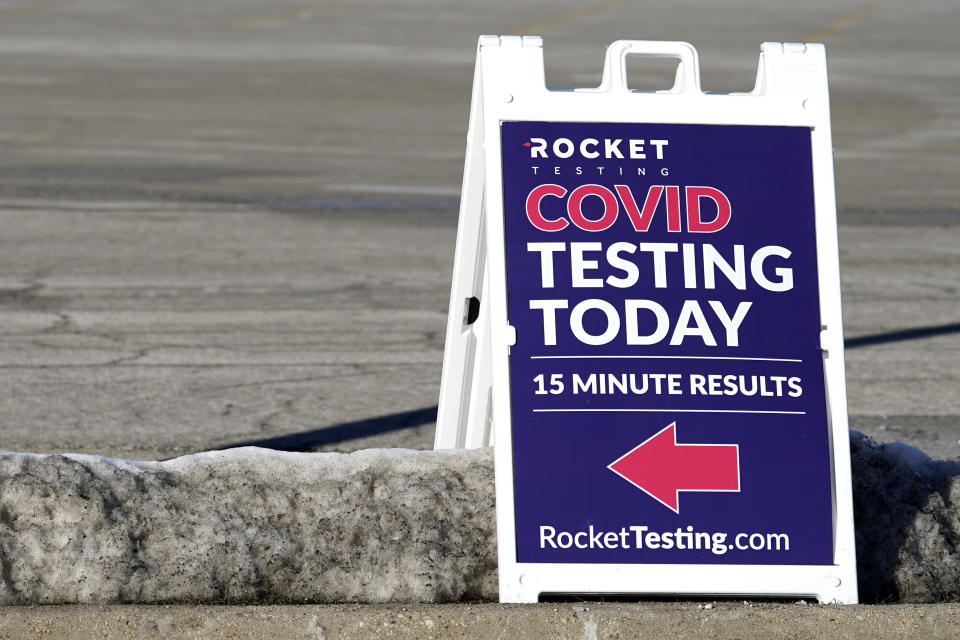 A COVID-19 testing site sign is seen at the Hawthorn Mall parking lot in Vernon Hills, Ill., Thursday, Jan. 21, 2021. A new drive-up rapid COVID-19 testing facility has opened in Vernon Hills. Rocket Testing, which currently has seven locations in the Chicago area. (AP Photo/Nam Y. Huh)