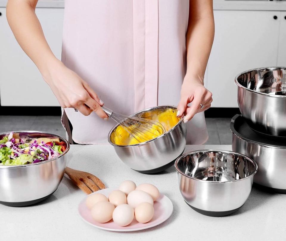 It's time to swap out the bowls you've had for 20 years with these sleek ones. This set of bowls even has silicone nonstick bottoms to prevent your bowl from sliding around while you toss a pasta salad or whisk eggs. They also come with lids.<br /><br /><strong>Promising review:</strong> "A VERY outstanding set of bowls. They are built to last a long, long time, very attractive stainless steel, inside measurements and a protective bottom to save your countertops. Very well though out, great sealing lids. I gave 4 stars for weight but that is a good thing!!!! These bowls are heavy duty and the 4-star rating is deceiving because these are not cheap, thinly made.... they are sturdy and robust!!!" &mdash; <a href="https://amzn.to/3afKcEe" target="_blank" rel="nofollow noopener noreferrer" data-skimlinks-tracking="5723569" data-vars-affiliate="Amazon" data-vars-href="https://www.amazon.com/gp/customer-reviews/R1E2Y975429972?tag=bfjasmin-20&amp;ascsubtag=5723569%2C10%2C31%2Cmobile_web%2C0%2C0%2C0" data-vars-keywords="cleaning,fast fashion" data-vars-link-id="0" data-vars-price="" data-vars-retailers="Amazon">Richard A Norman</a><br /><br /><strong>Get a set of five from Amazon for <a href="https://amzn.to/2RFL6Ue" target="_blank" rel="noopener noreferrer">$32.99</a>.</strong>