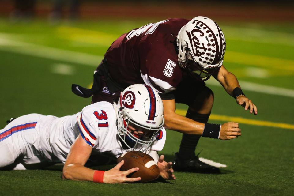 Gregory-Portland's Jackson Sutton (31) recovers a fumble during a high school football game against Calallen at Phil Danaher Stadium in Corpus Christi, Texas on Thursday, Aug. 25, 2022.