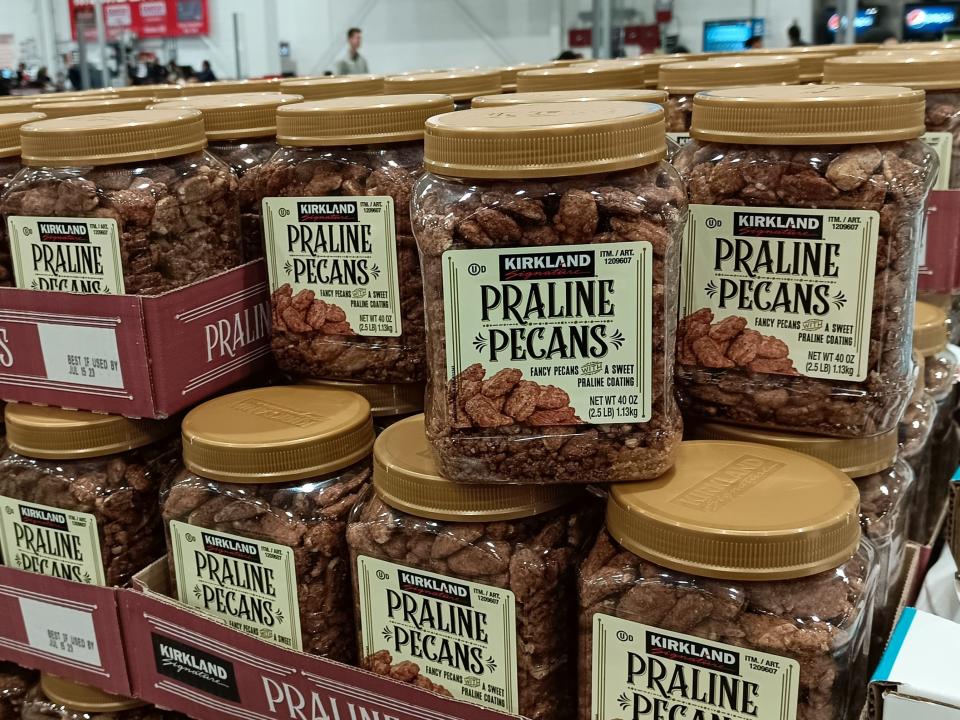 clear and gold containers of praline pecans stocked at Costco