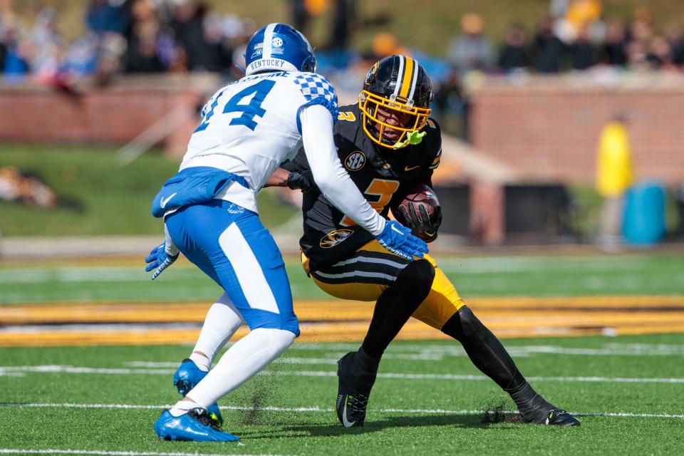 Nov 5, 2022; Columbia, Missouri, USA; Missouri Tigers wide receiver Luther Burden III (3) looks to get around Kentucky Wildcats cornerback Elijah Reed (24) during the fourth quarter at Faurot Field at Memorial Stadium. Mandatory Credit: William Purnell-USA TODAY Sports