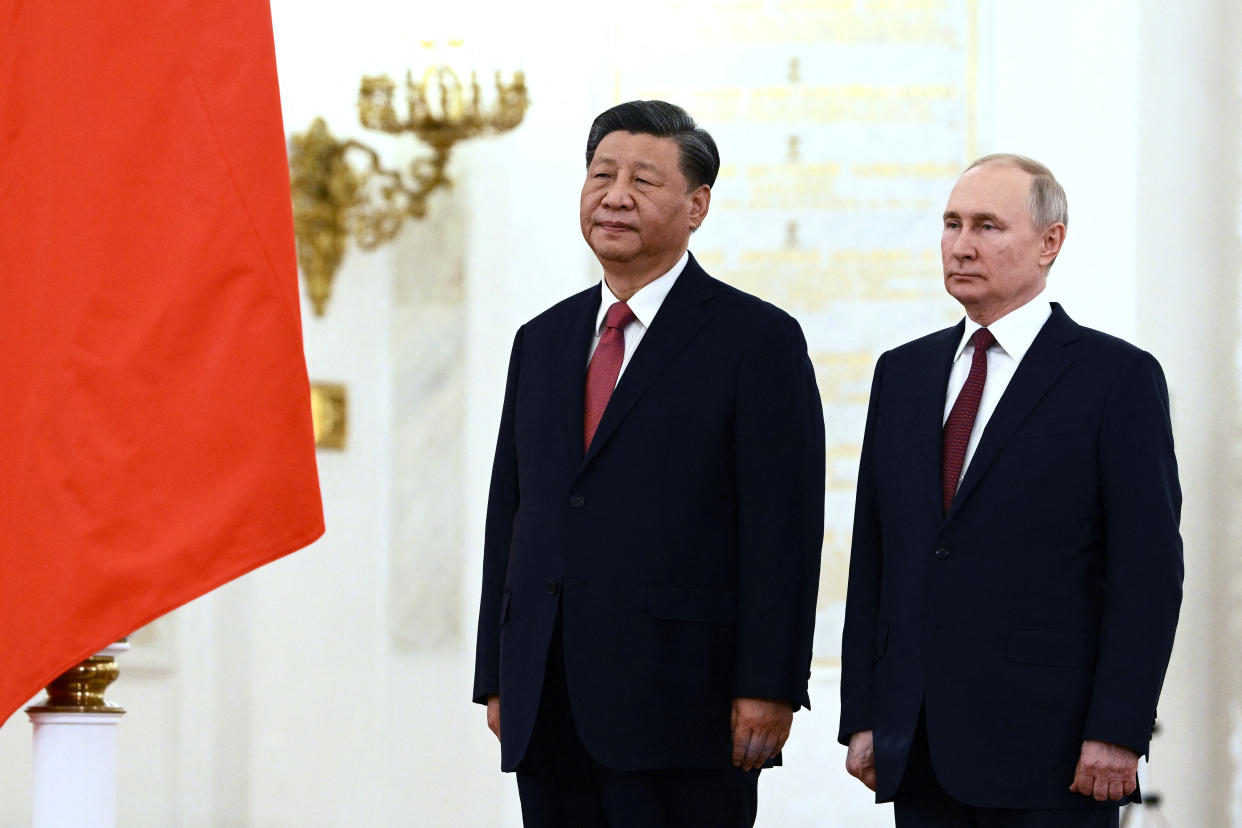 Russian President Vladimir Putin and Chinese President Xi Jinping attend a welcome ceremony before Russia - China talks in narrow format at the Kremlin in Moscow, Russia March 21, 2023. Sputnik/Alexei Maishev/Kremlin via REUTERS ATTENTION EDITORS - THIS IMAGE WAS PROVIDED BY A THIRD PARTY.