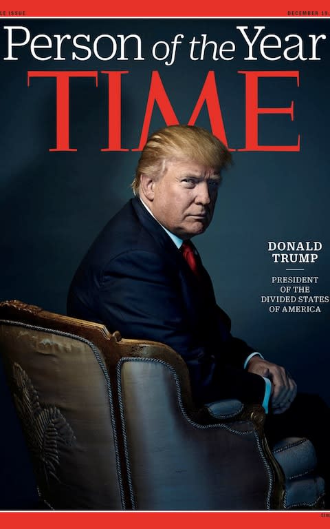 US President-elect Donald Trump poses on the cover of Time Magazine after being named its person of the year in 2016 - Credit: Handout/Reuters