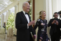 President Joe Biden and first lady Jill Biden arrive to attend the Kennedy Center honorees reception at the White House in Washington, Sunday, Dec. 4, 2022. (AP Photo/Manuel Balce Ceneta)