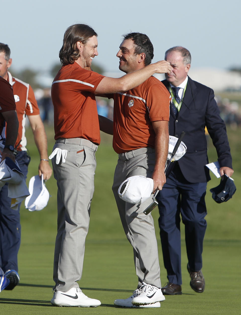 Europe's Francesco Molinari, right, and Tommy Fleetwood embrace after winning a foursome match on the second day of the 42nd Ryder Cup at Le Golf National in Saint-Quentin-en-Yvelines, outside Paris, France, Saturday, Sept. 29, 2018. Europe's Francesco Molinari and Tommy Fleetwood beat Tiger Woods of the US and Bryson Dechambeau of the US 5 and 4. (AP Photo/Alastair Grant)