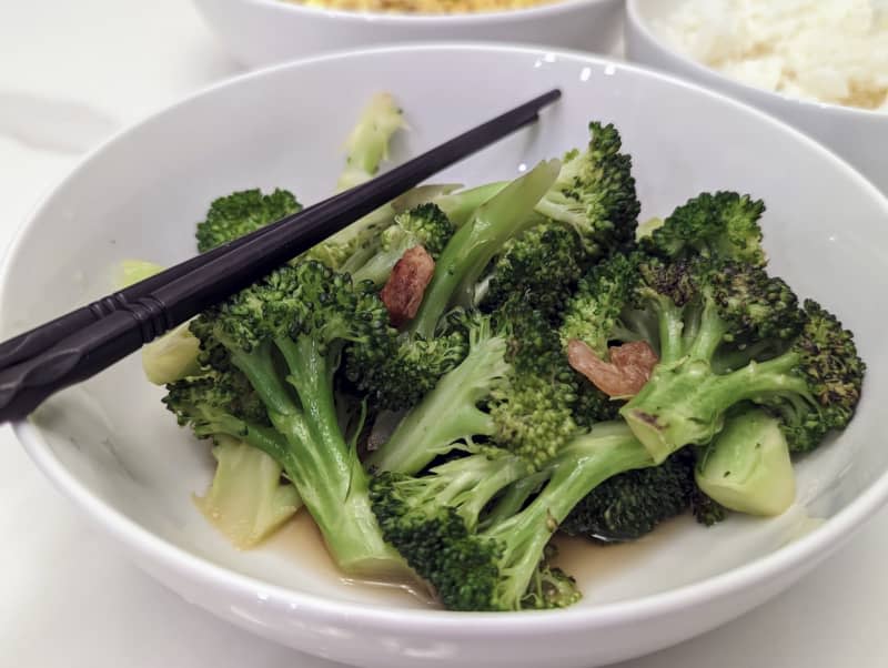Seasoned broccoli in a bowl.