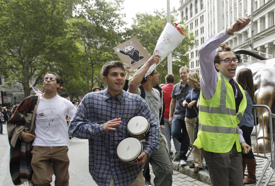 In this Sept. 17, 2011 file photo, a man beats a pair of bongo drums as demonstrators affiliated with the Occupy Wall Street movement gather to call for the occupation of Wall Street in New York. Monday, Sept. 17, 2012 marks the one-year anniversary of the Occupy Wall Street movement. (AP Photo/Frank Franklin II, File)