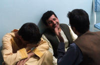 <p>Relatives mourn after a suicide attack on a mosque in Herat, Afghanistan, Tuesday, Aug. 1, 2017. (Photo: Hamed Sarfarazi/AP) </p>