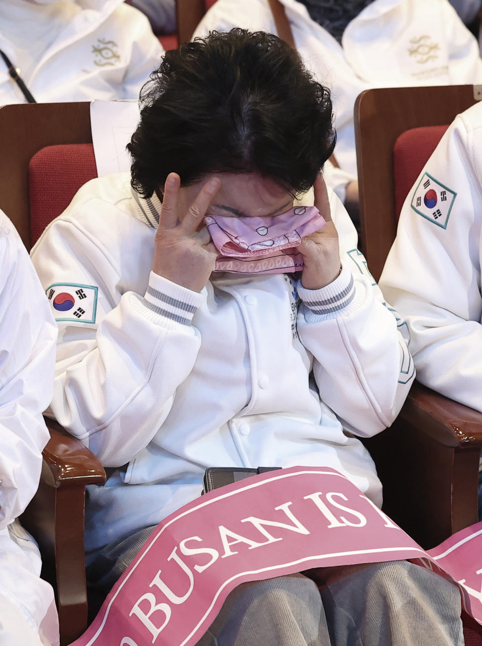 A South Korean supporter weeps after the South Korean city of Busan failed to win the right to host the 2030 World Expo, in Busan, South Korea, Wednesday, Nov. 29, 2023. (Son Hyung-joo/Yonhap via AP)