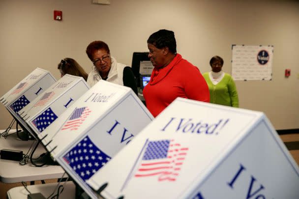 PHOTO: An election worker instructs a voter at the West End Community Development Center during the 2020 South Carolina Primary in South Carolina. (Jeremy Hogan/Sopa Images/Sipa USA via AP, FILE)