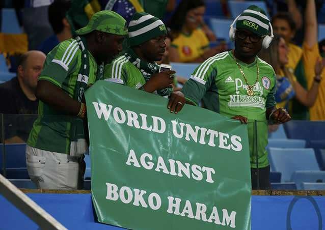 Nigerian fans hold a banner against Boko Haram during the 2014 World Cup. Picture: Reuters