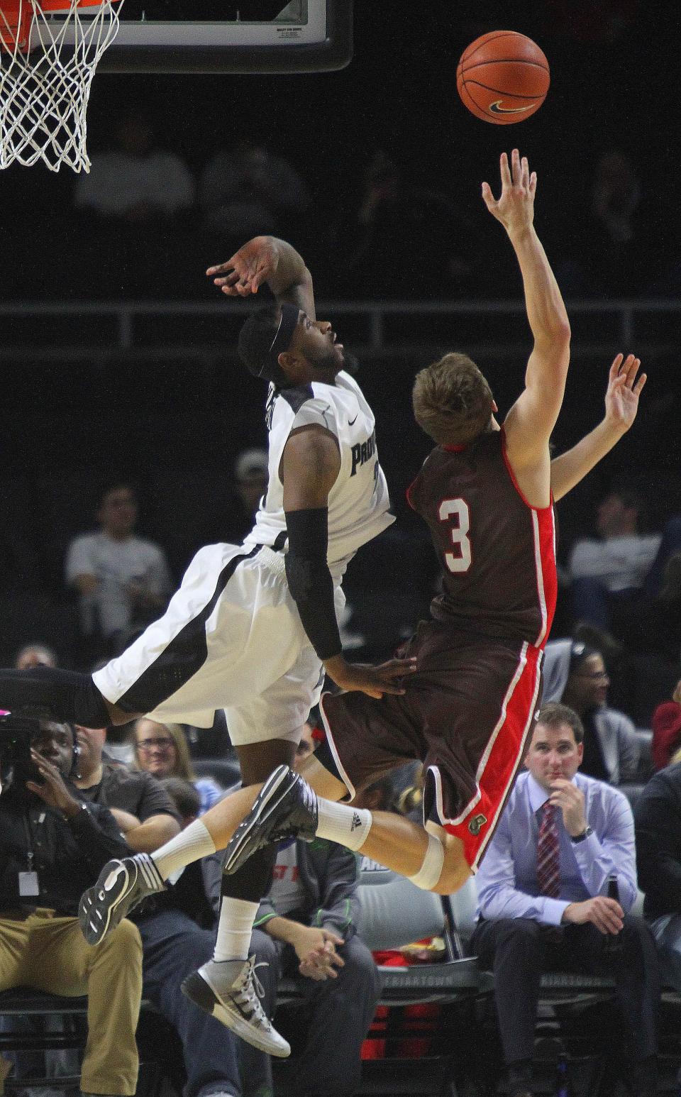 PC's LaDontae Henton, left, fouls Brown's Steven Spieth during a game in 2013.
