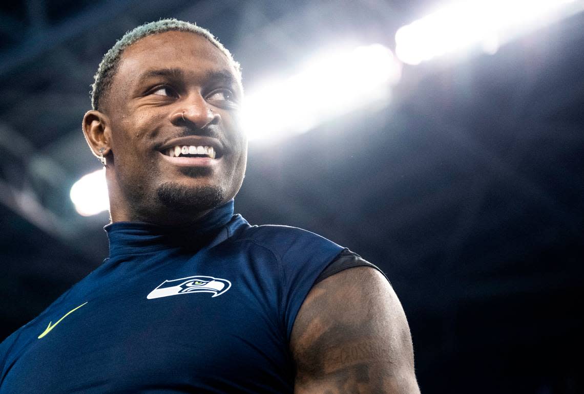 Seattle Seahawks wide receiver DK Metcalf (14) smiles as he talks to San Francisco 49ers players on the field after an NFL game at Lumen Field in Seattle Wash. on Dec. 15, 2022.