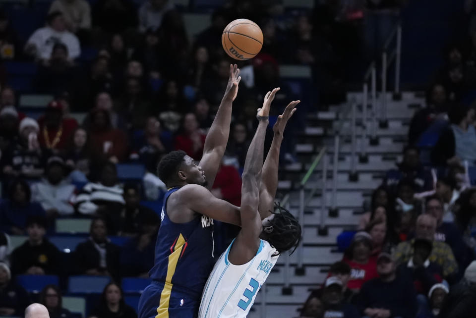 New Orleans Pelicans forward Zion Williamson (1) shoots against Charlotte Hornets center Nathan Mensah in the first half of an NBA basketball game in New Orleans, Wednesday, Jan. 17, 2024. (AP Photo/Gerald Herbert)