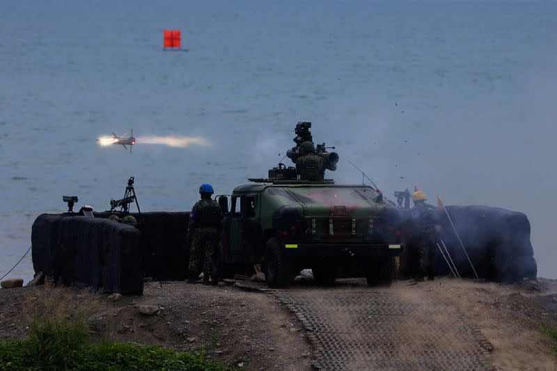 A solider launches a US-made TOW 2A missile during a live fire drill in Pingtung