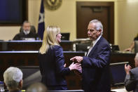 Prosecutor Tamara Strauch, left, speaks with defense attorney Raymond Fuchs during the capital murder trial of Otis McKane in the 2016 shooting death of San Antonio Police Detective Benjamin Marconi, Monday, July 26, 2021, in San Antonio. Jurors deliberated about 25 minutes Monday before convicting McKane. (Robin Jerstad/The San Antonio Express-News via AP)