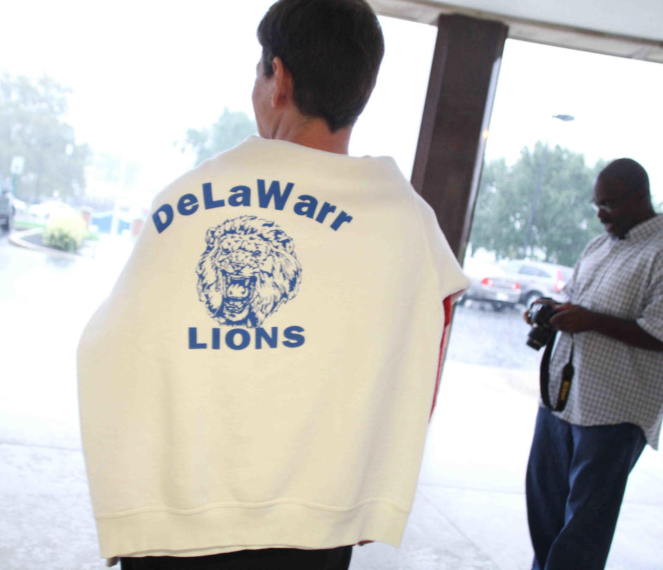 Arleen Rossi Kerrigan shows off her De La Warr Lions sweatshirt during a reunion.