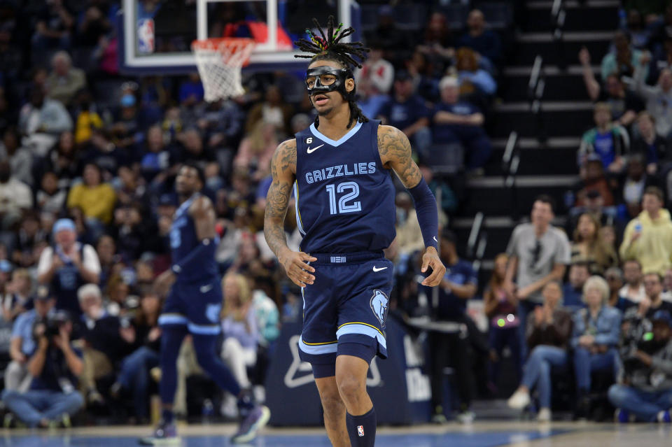 Memphis Grizzlies guard Ja Morant (12) plays in the second half of an NBA basketball game against the Houston Rockets Wednesday, March 22, 2023, in Memphis, Tenn. (AP Photo/Brandon Dill)