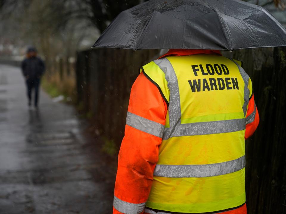 Volunteer flood warden Keith Crabtree MBE checks flooding on train tracks in Todmorden, West YorkshireChristopher Furlong/Getty Images