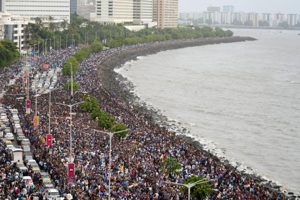 Fans wait for the arrival of Indian cricket players for a victory parade in Mumbai (Reuters)