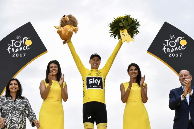 Tour de France 2017's winner Great Britain's Christopher Froome celebrates his overall leader yellow jersey on the podium at the end of the 103 km twenty-first and last stage of the 104th edition of the Tour de France cycling race on July 23, 2017