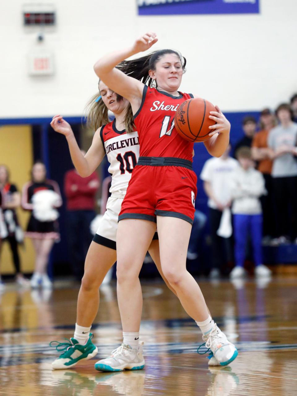 Thornville Sheridan's Payton Powell, front, and Circleville's Isabelle Perini fight for a loose ball during their Division II district final Wednesday at Chillicothe Southeasterm. Sheridan won 50-30 to advance to its sixth regional in seven years under coach J.D. Walters.