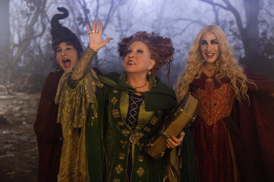 This image released by Disney shows, from left, Kathy Najimy as Mary Sanderson, Bette Midler as Winifred Sanderson, and Sarah Jessica Parker as Sarah Sanderson in "Hocus Pocus 2." (Matt Kennedy/Disney via AP)