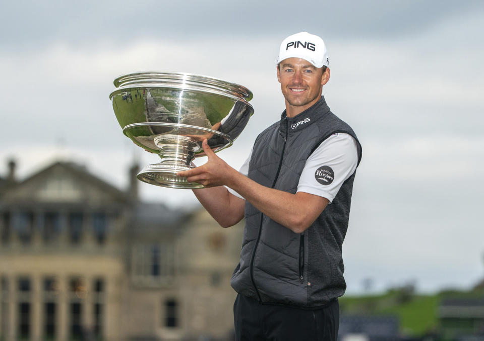 Victor Perez shows off the trophy following his win of the Links Championship at St Andrews in Scotland, Sunday Sept. 29, 2019. (Kenny Smith/PA via AP)