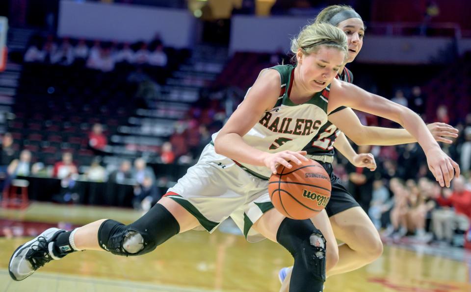 Lincoln's Kloe Froebe (5) moves the ball against Deerfield's Lexi Kerstein in the second half of the Class 3A state semifinals Friday, March 3, 2023 at CEFCU Arena in Normal. The Railers advanced to the title game with a 76-56 win over the Warriors.