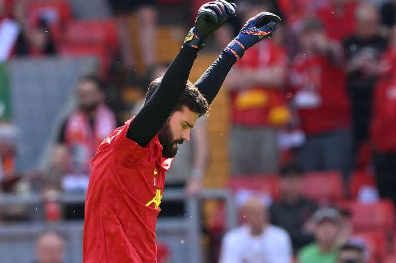 Alisson Becker of Liverpool during the warm-up before the Premier League match between Liverpool FC and Wolverhampton Wanderers at Anfield on May 19, 2024 in Liverpool, England.