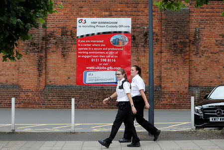 Prison workers enter HMP Birmingham after the British government took over its running from G4S, in Birmingham, Britain August 20, 2018. REUTERS/Darren Staples