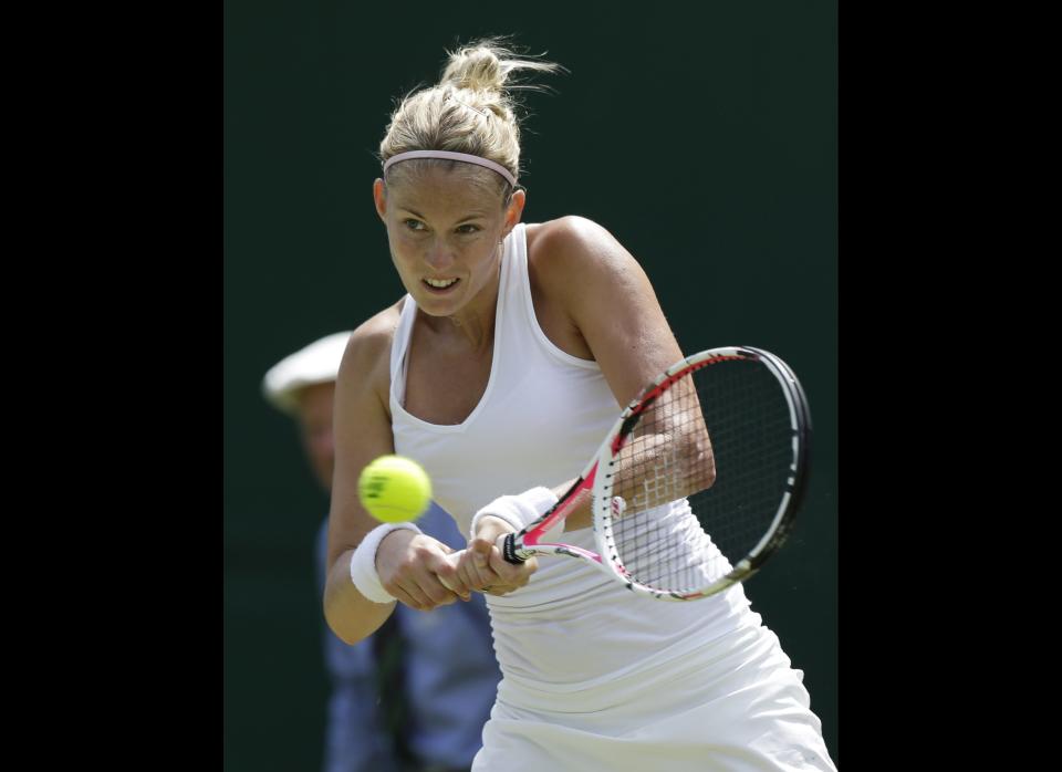 Mathilde Johansson of France returns a shot to Christina McHale of the United States during a second round women's singles match at the All England Lawn Tennis Championships at Wimbledon, England, Thursday, June 28, 2012. 