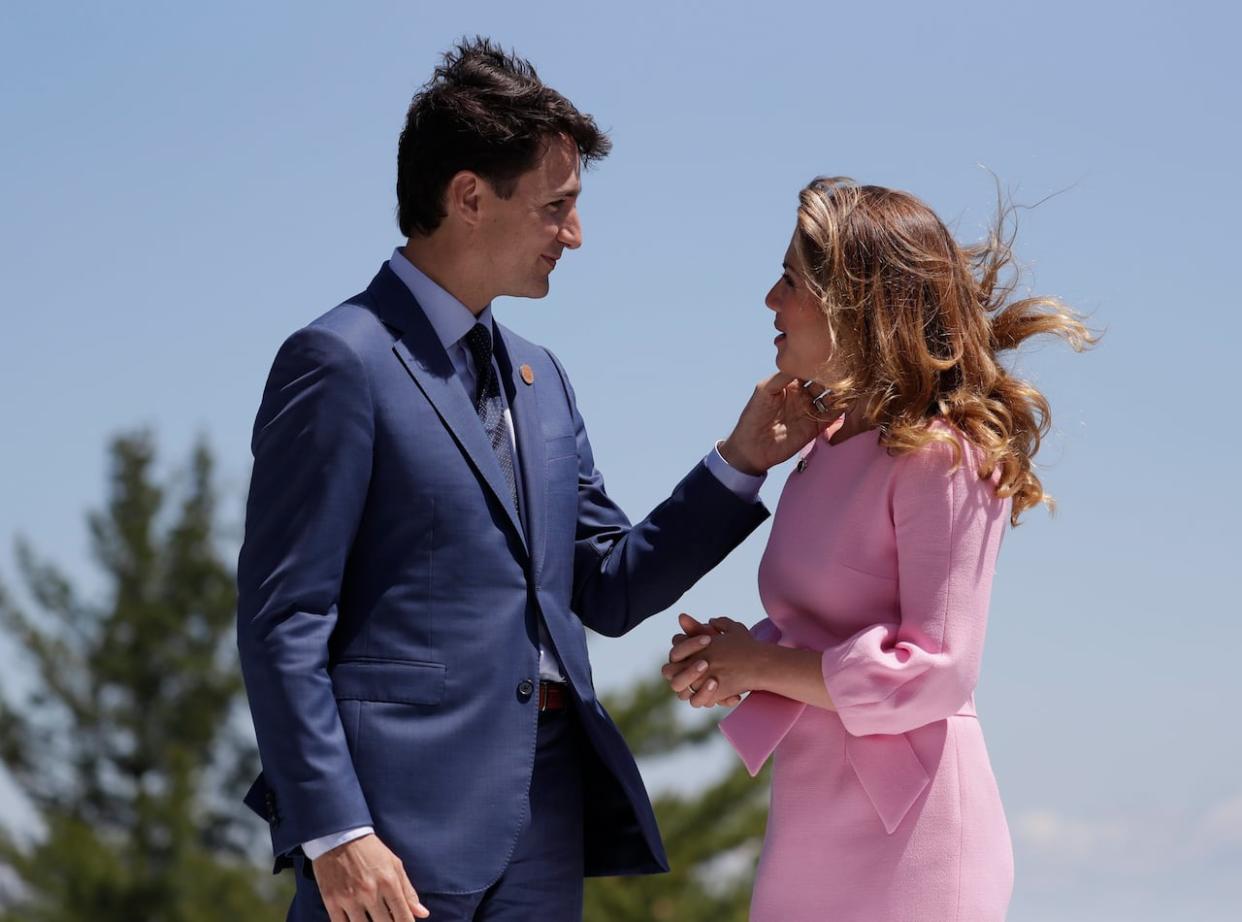 Prime Minister Justin Trudeau and his wife Sophie Grégoire Trudeau talk prior to the beginning of a welcoming ceremony during the G7 Summit, Friday, June 8, 2018, in Charlevoix, Canada. The couple announced they would be separating on Wednesday. (Evan Vucci/Associated Press - image credit)