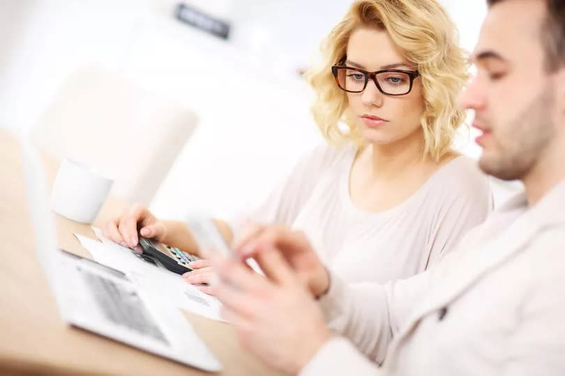 A young couple with financial documents