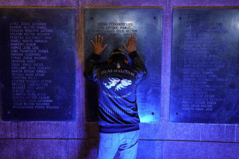 A man stands at a war memorial during a ceremony marking the 42nd anniversary of the conflict between Argentina and Great Britain over the Falkland Islands or Malvinas Islands in Buenos Aires, Argentina, Monday, April 1, 2024. (AP Photo/Natacha Pisarenko)