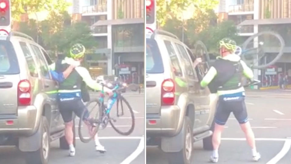 A brawl has broken out between a cyclist and driver while waiting at a red light. Source: Instagram - dt_tran