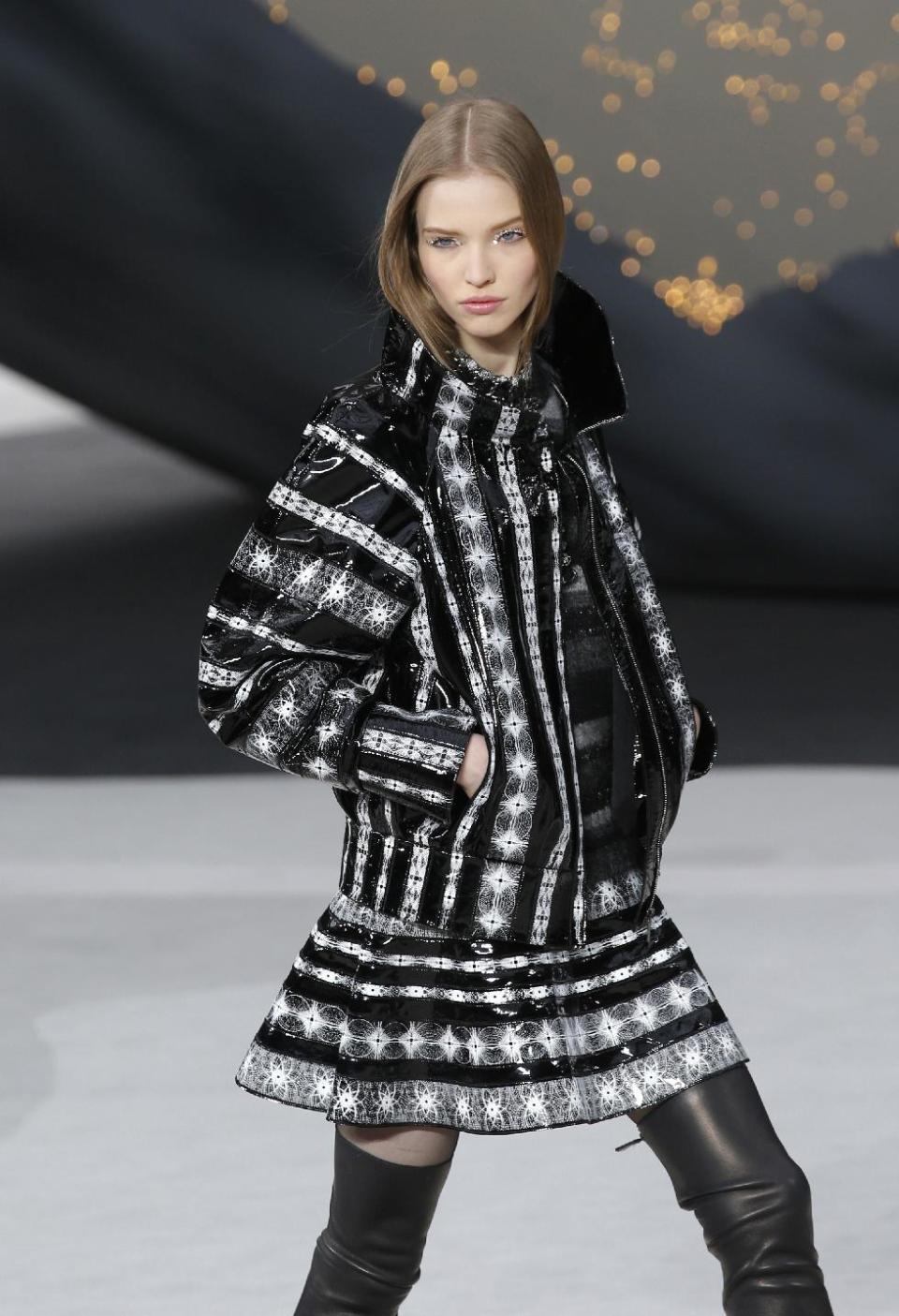 A model wears a creation by German fashion designer Karl Lagerfeld for Chanel's Fall/Winter 2013-2014 ready to wear collection, in Paris, Tuesday, March, 5, 2013. (AP Photo/Christophe Ena)