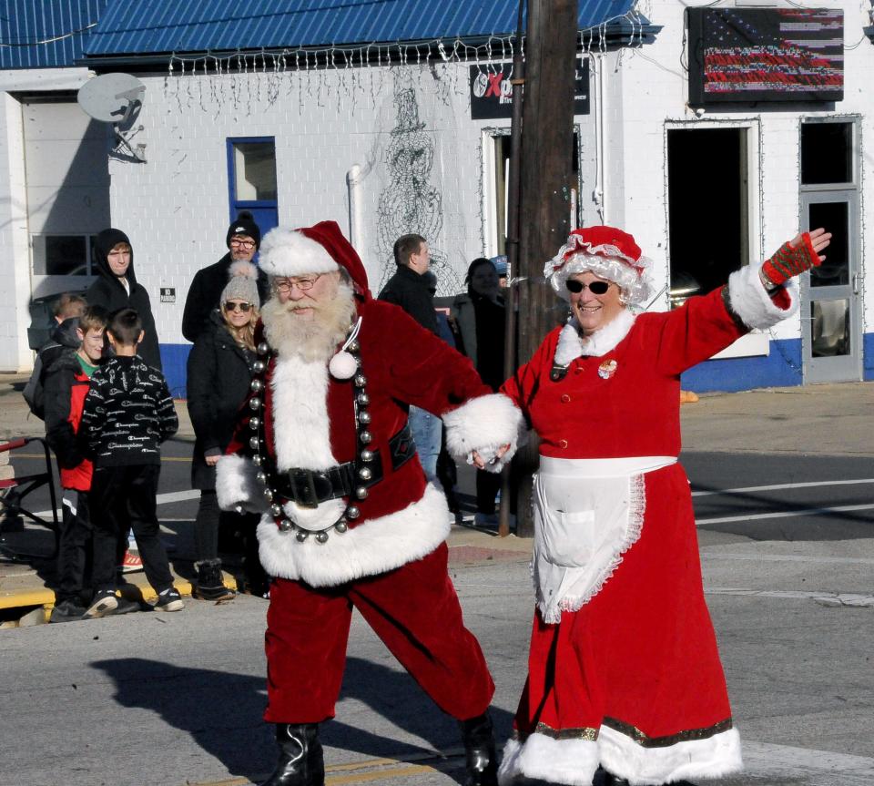 Santa and Mrs. Claus walked the parade route and greeted ll the kids.