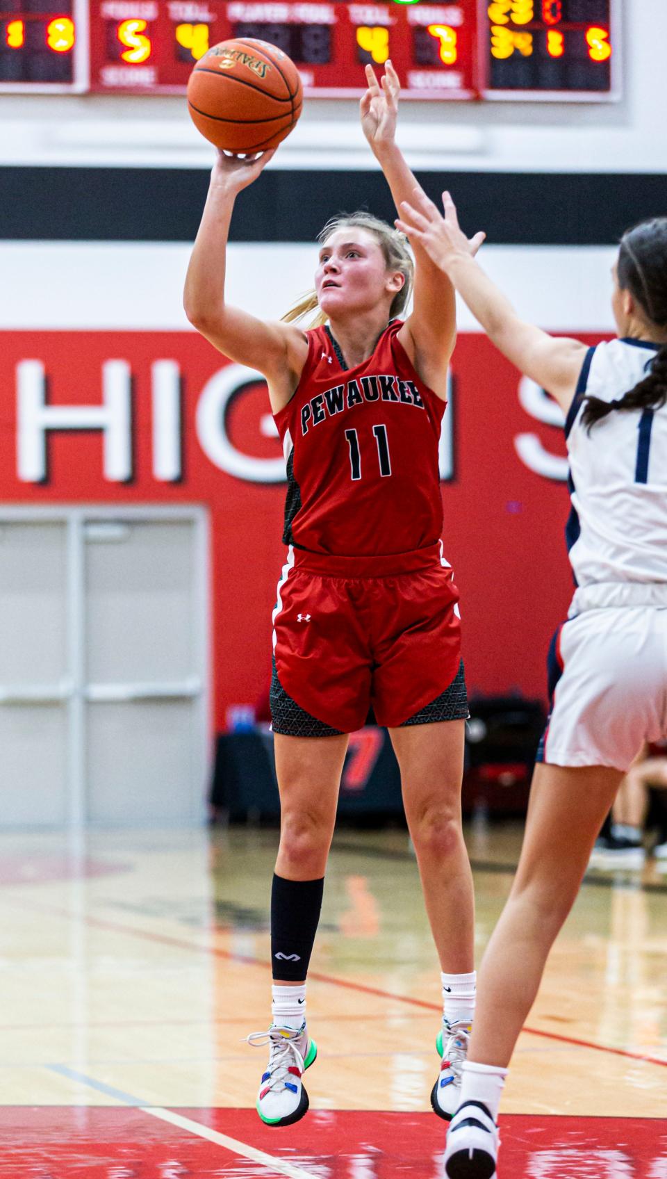 Pewaukee's Sarah Newcomer (11) elevates for a shot during the game at home against Brookfield East on Tuesday, Nov. 23, 2021.