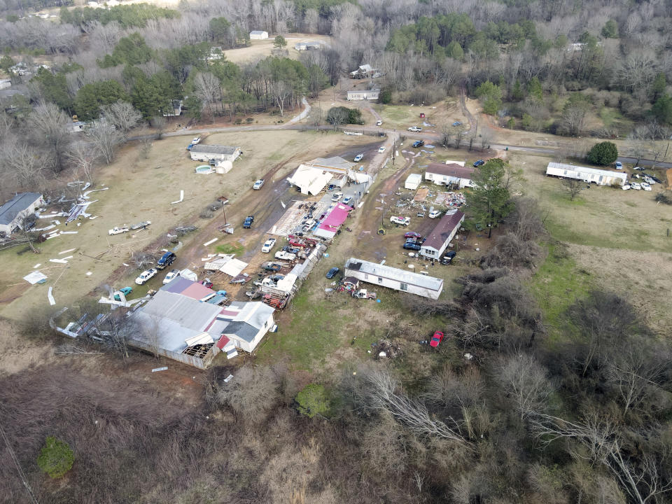 Devastation is seen in the aftermath from severe weather, Thursday, Jan. 12, 2023, in Moundville, Ala. A giant, swirling storm system billowing across the South spurred a tornado on Thursday that shredded the walls of homes, toppled roofs and uprooted trees. (Mike Goodall via AP)