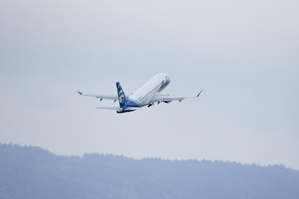 Alaska Airlines Embraer E175L flight 2242 takes off from Portland International Airport in Portland, Ore., Saturday, Jan. 6, 2024. The FAA has ordered the temporary grounding of Boeing 737 MAX 9 aircraft after part of the fuselage blew out during a flight. (AP Photo/Craig Mitchelldyer)