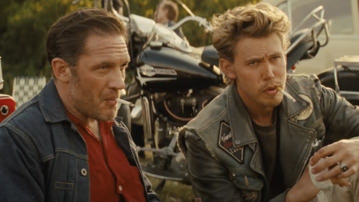 Two men smoke in The Bikeriders.