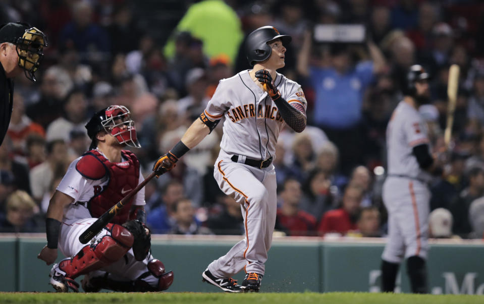 San Francisco Giants' Mike Yastrzemski watches the flight of his solo home run in the fourth inning of a baseball game against the Boston Red Sox at Fenway Park in Boston, Tuesday, Sept. 17, 2019. Yastrzemski is the grandson of Red Sox great and Hall of Famer Carl Yastrzemski. (AP Photo/Charles Krupa)