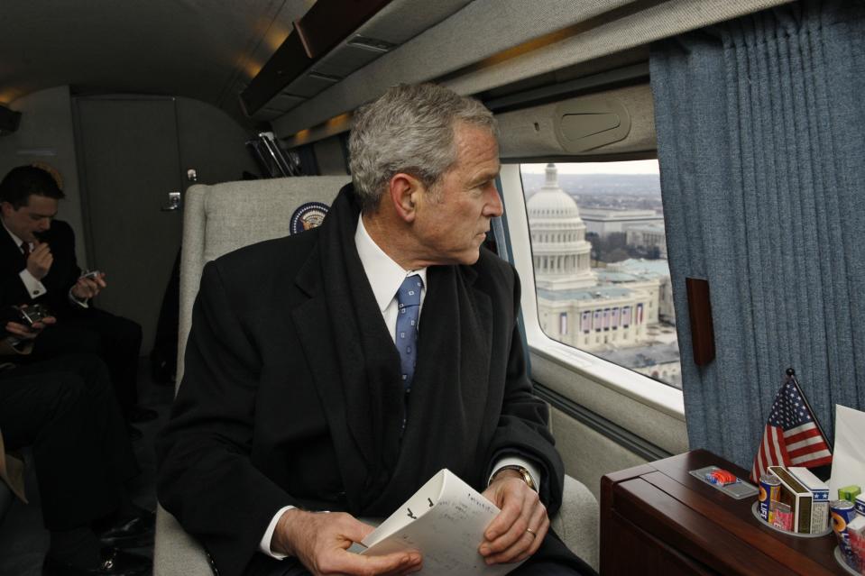 Former President George W. Bush looks out over the U.S. Capitol as his helicopter departs January 20, 2009 in Washington, D.C. Bush is heading to Andrews Air Force Base following the inauguration ceremonies for U.S. President Barack Obama. (Photo: Eric Draper/The White House via Getty Images)